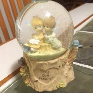 Rare precious moments, musical snow globe. Plays “love will keep us together”.